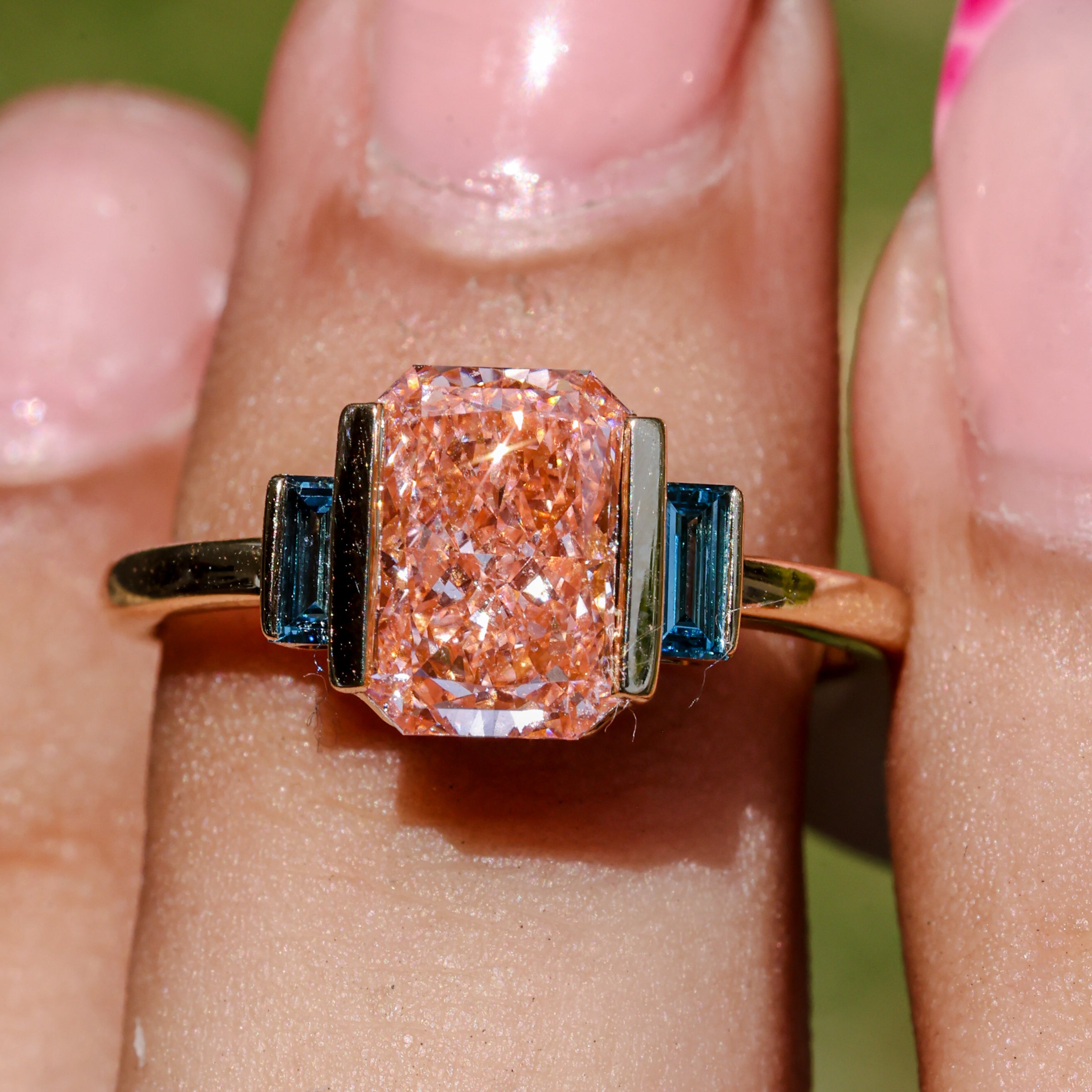 2.37 CT Pink Emerald Cut Lab Grown Diamond Engagement Ring with Blue Baguette Accent Stones  14K Yellow Gold