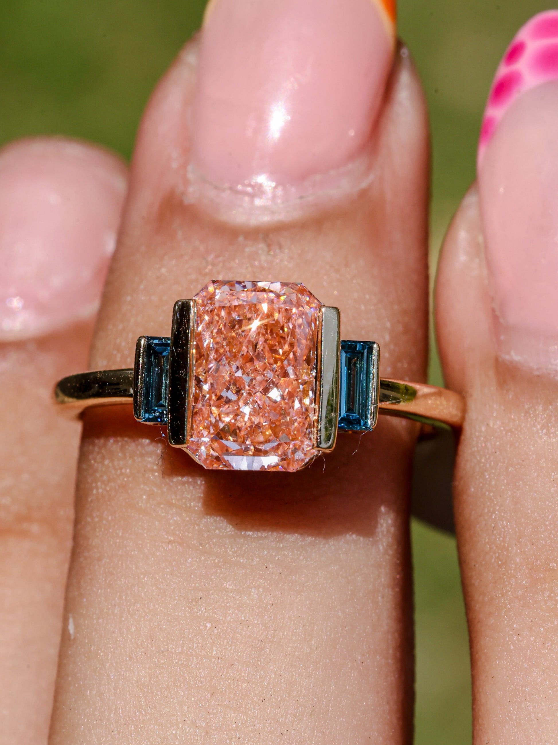 2.37 CT Pink Emerald Cut Lab Grown Diamond Engagement Ring with Blue Baguette Accent Stones  14K Yellow Gold