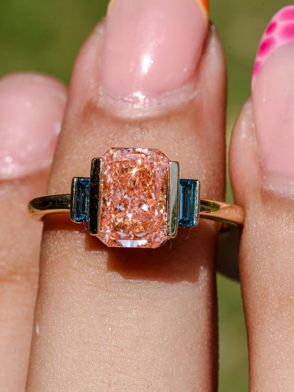 2.37 CT Pink Emerald Cut Lab Grown Diamond Engagement Ring with Blue Baguette Accent Stones  14K Yellow Gold